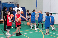 Mini-Basketball coach in sports hall